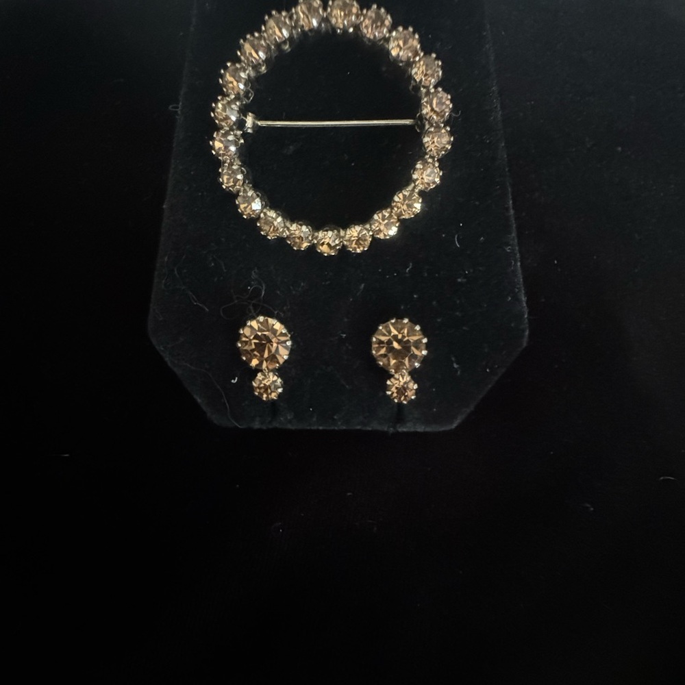 B. David brooch with matching earrings